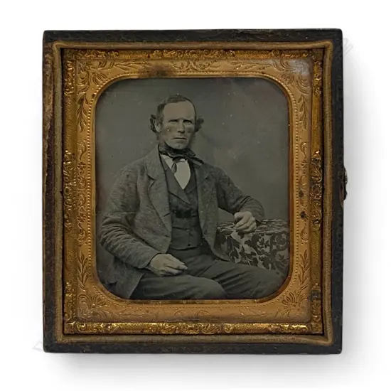 Gilt framed and leather cased ambrotype - seated man in tweed jacket,